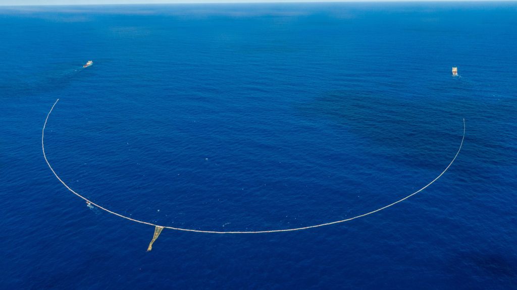 A picture of the System 03 owned by The Ocean Cleanup organization conducting a clean up in the ocean.
